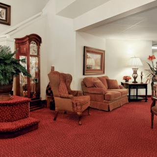 A cozy living room with classic furniture and warm lighting.
