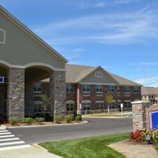 Exterior view of a modern hospital building with a prominent entrance.