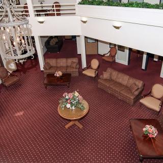 A spacious hotel lobby with comfortable seating and elegant decor.