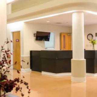 Modern reception area with a welcoming desk and clean interior design.