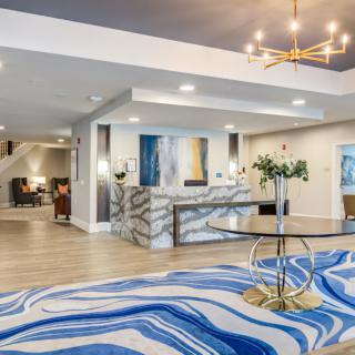 A modern hotel lobby with a stylish reception area and contemporary decor.
