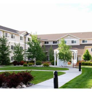 A serene residential complex featuring well-maintained grounds and inviting pathways.