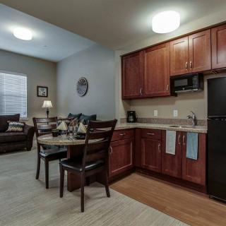A cozy apartment kitchen and dining area with modern furnishings.
