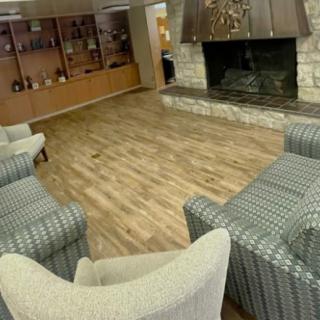 A cozy living room featuring a fireplace and comfortable seating arrangement.