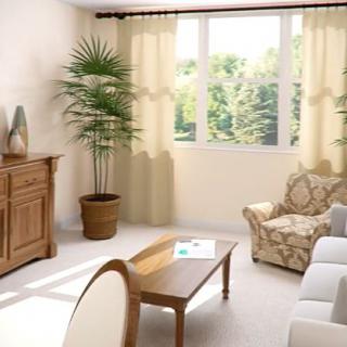 A cozy living room with elegant furniture and a large window allowing natural light to fill the space.