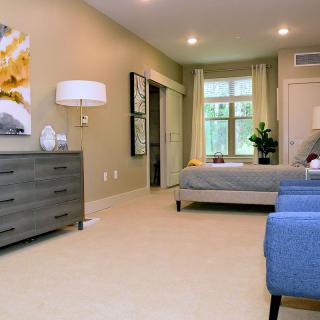 A modern bedroom with stylish furnishings and a cozy atmosphere.