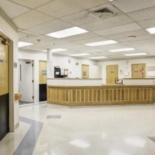 An empty hospital reception area with a clean and well-lit interior.