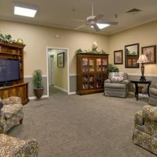 A cozy living room with comfortable seating and a television.