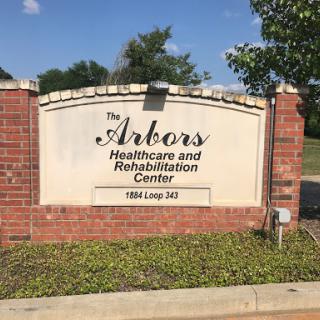 Sign for the Arkos Healthcare and Rehabilitation Center.
