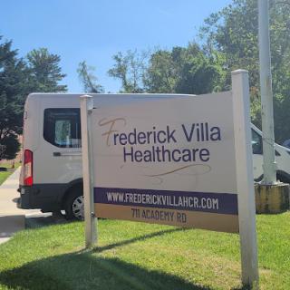 Sign for Frederick Villa Healthcare, featuring a vehicle parked nearby.