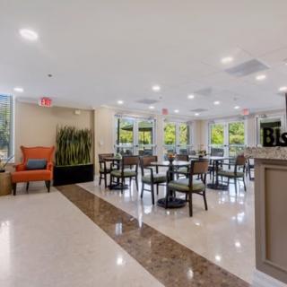 A modern dining area with ample seating and bright lighting.