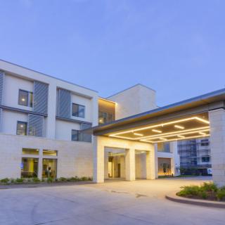 A modern building showcasing a stylish entrance and contemporary architectural design.