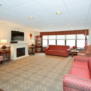 A cozy living room featuring a fireplace and comfortable seating.