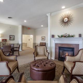 A cozy living room with comfortable seating and a fireplace.