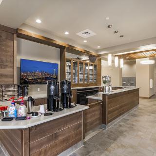 A modern coffee station with sleek design and various beverage options.