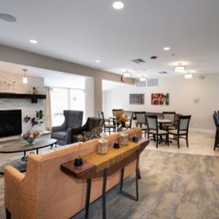 A stylish and spacious living and dining area blending modern comfort with a welcoming ambiance.