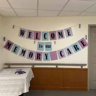 A warm welcome banner for a memory care facility, creating a friendly and supportive atmosphere.