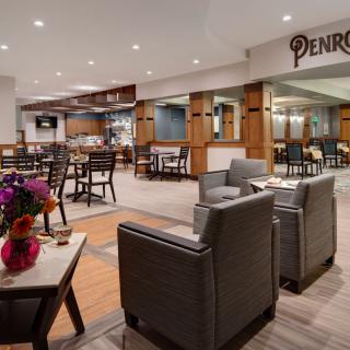 A modern restaurant interior with comfortable seating and stylish decor.