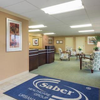 A welcoming reception area of Saber Healthcare Group, featuring comfortable seating and a professional ambiance.