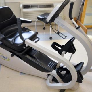 A recumbent exercise bike in a fitness room.