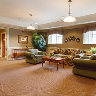 A cozy living room with comfortable seating and warm lighting.