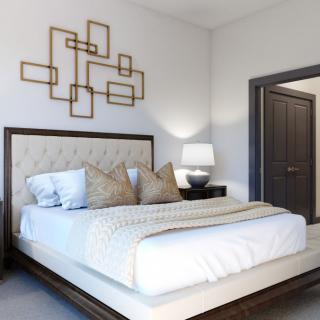 A modern and elegantly designed bedroom with stylish decor and furnishings.