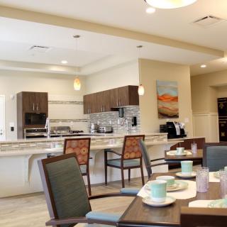 A modern open-concept kitchen and dining area with stylish furnishings.