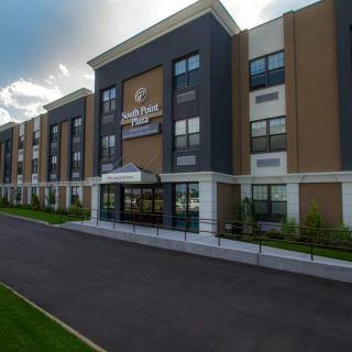 Exterior view of a modern hotel building with a welcoming entrance.