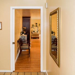A view through a doorway into a cozy living room, featuring elegant furniture and decor.