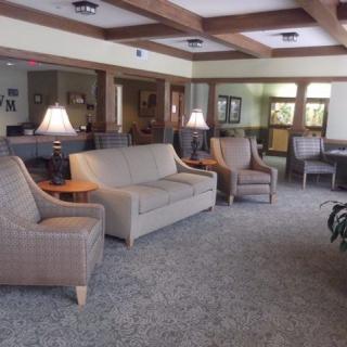 A cozy living room with comfortable seating and warm lighting.