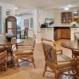 A cozy dining and kitchen area with wooden furniture and decor.