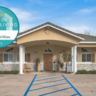A residential building with a welcoming entrance and a sign indicating 'Best of Assisted Living'.
