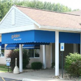 A storefront with a blue awning and entrance.
