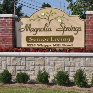 Entrance sign for Magnolia Springs Senior Living at 8225 Whipps Mill Road.