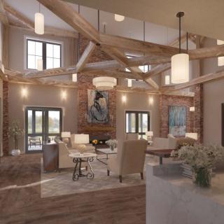 A modern living room with exposed wood beams, brick walls, and elegant chandeliers.