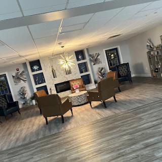 A beautifully designed lounge area featuring comfortable seating and modern decor.