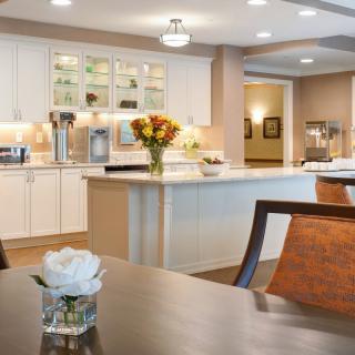 A modern kitchen and dining area with elegant decor.