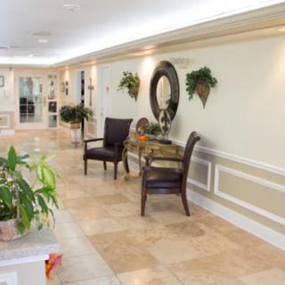 Elegant hallway with decorative elements and seating area.