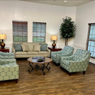 A cozy living room setup with comfortable seating and warm lighting.