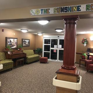 A cozy and welcoming lobby area featuring comfortable seating and warm lighting.