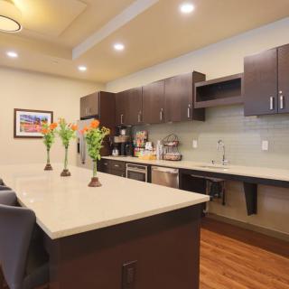 A modern kitchen interior with sleek cabinets and a spacious island.