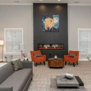 Modern living room with stylish furniture and artwork.