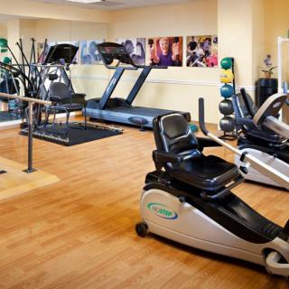 A well-equipped gym with treadmills and stationary bikes.