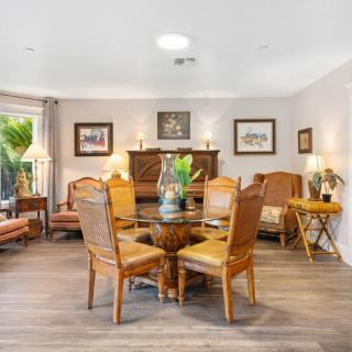 A cozy living and dining area with wooden furniture and tasteful decor.