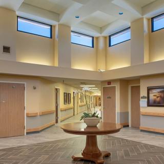 A well-lit hallway with modern decor and elegant architectural design.