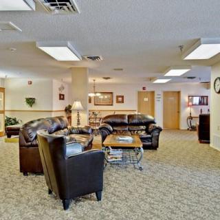 A comfortable lobby area with leather seating and soft lighting.