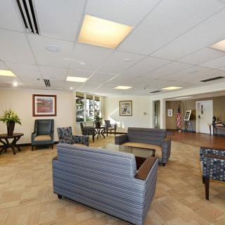 A well-lit lobby area with comfortable seating and tasteful decor.
