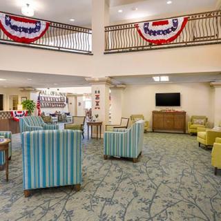 A welcoming lobby area with comfortable seating and festive decorations.