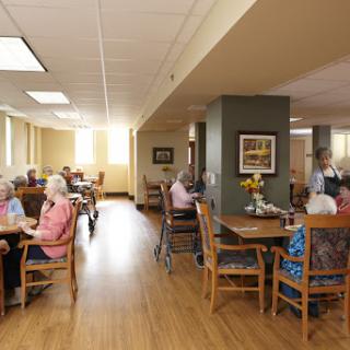 A warm and inviting dining area in a senior living community, where residents gather for meals and socialization.