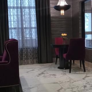 A stylish dining area featuring elegant furniture and modern dcor.